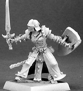 A male human fighter attacking. He is wearing full plate armour and a helmet. He is also wearing a back skirt that is fixed into his belt. In one hand he holds a metal heater shaped shield. In the other is his upright sword, ready to strike.