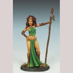 A female elf wizard standing still. She wears a small crop top and a long floor length loin cloth from a delicate belt. One hand is on her hip. The other holds a tall wooden staff.