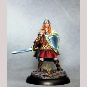 A female human fighter standing still. She wears a robe, trousers and knee height leather boots. Over the top of the robe she wears a quilted surcoat. A helmet protects her head, and a gauntlet covers her sword hand. One hand holds a heater shaped shield close to her body. The other holds the hilt of a sword, drawn and ready for use.