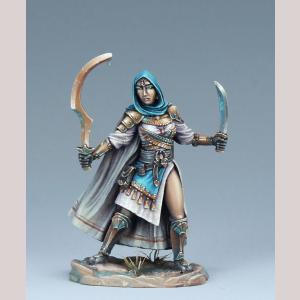 A female human fighter standing with both her weapons raised. She wears metal pauldrons and shin protectors, up the front of her knee high boots. She wears a short robe with a tassled woven cloth over the front of that. In one hand she holds an upright khopesh sword. In the other a slightly curving dagger.