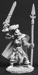 An undead skeleton warrior wearing a full length cloak and calf height boots. In one boney hand he holds a rune sword above his head. In the other he holds a tall upright spear. He wears a plumed helmet on his head. Unpainted metal RPG tabletop gaming miniature.