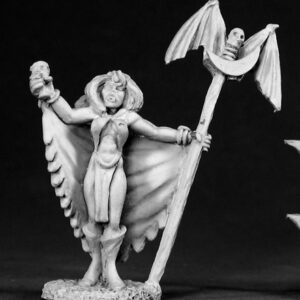 A female undead vampire wearing scant clothing apart from a floor length tapering cloak. She has calf length boots and holds a skull shaped chalice in one hand. In the other she holds a long staff with a skull flanked either side with a pair of bat wings at its top.