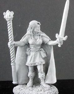 A female elf wizard standing still. She is smartly dressed in a fine tunic, trousers and calf high boots. A floor lengh cloak covers her back. In one hand she holds a tall staff with a barleytwist shaft and ornate orb end. In her other hand she holds an upright sword.