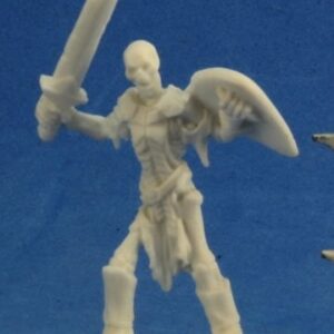 An upright undead skeleton holding a sword in one hand, and a curved triangular shield in the other. He wears a a tattered robe and apair of high legged boots. Unpainted plastic RPG tabletop gaming miniature.