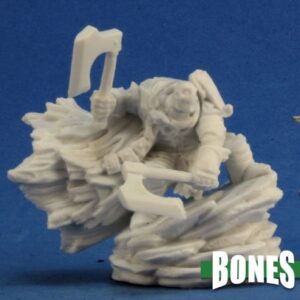 A male human undead warrior crouching atop a flat topped sloping rock pile. He is wearing heavy armour and weilds a single bladed axe in each hand. Unpainted plastic RPG tabletop gaming miniature.
