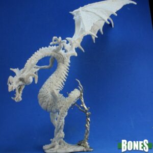 A large winged dragon. Unpainted plastic RPG tabletop gaming miniature.